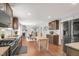 Open kitchen featuring granite countertops, stainless appliances and hardwood floors at 106 E Delafield Ave, Durham, NC 27704