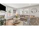 Bright and airy living room with a large sectional sofa, decorative pillows, and modern accents at 106 E Delafield Ave, Durham, NC 27704