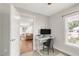 Office space with an ergonomic chair, a stand-up desk, and natural lighting at 106 E Delafield Ave, Durham, NC 27704