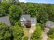 Aerial view of home with lush green surroundings and a well-manicured lawn at 107 Ashwick Ct, Cary, NC 27513