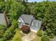 Aerial view showcases a lovely home with mature trees and landscaping in the neighborhood at 107 Ashwick Ct, Cary, NC 27513
