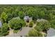 Aerial view showcases a well-maintained home in a mature, tree-lined neighborhood at 107 Ashwick Ct, Cary, NC 27513