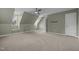 Spacious carpeted bedroom with two dormer windows and a standard closet with a white door at 107 Ashwick Ct, Cary, NC 27513