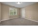 Bedroom featuring neutral carpet and a bright window at 107 Ashwick Ct, Cary, NC 27513