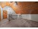 Carpeted bonus room features a wood-paneled ceiling, and iron railing at 107 Ashwick Ct, Cary, NC 27513