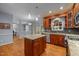 Well-designed kitchen offering granite countertops, stainless steel appliances, a center island, and easy access to dining at 107 Ashwick Ct, Cary, NC 27513