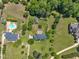 Aerial shot showcasing well-spaced homes with manicured lawns and in-ground swimming pools at 107 Stargrass Ave, Clayton, NC 27527