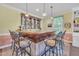 Entertain in style at this wet bar with custom cabinetry and seating at 107 Stargrass Ave, Clayton, NC 27527
