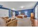 Spacious bedroom showcases vaulted ceilings, blue walls, carpet and two points of entry at 107 Stargrass Ave, Clayton, NC 27527
