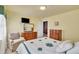 Bright bedroom featuring neutral tones, natural lighting, and wood furniture at 107 Stargrass Ave, Clayton, NC 27527