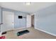 Bedroom with neutral walls, carpet and white trim, showcasing bright and airy living space at 107 Stargrass Ave, Clayton, NC 27527