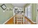 Inviting dining area with hardwood floors and french doors adjacent to the kitchen at 107 Stargrass Ave, Clayton, NC 27527