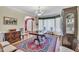 Elegant dining room featuring a classic rug, hardwood floors, and bright natural light at 107 Stargrass Ave, Clayton, NC 27527