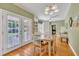 Dining area with hardwood floors and French doors to outside at 107 Stargrass Ave, Clayton, NC 27527