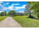 Beautiful brick home with a manicured lawn and lush landscaping at 107 Stargrass Ave, Clayton, NC 27527