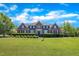 Beautiful brick home with a manicured lawn and lush landscaping at 107 Stargrass Ave, Clayton, NC 27527