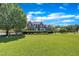 Beautiful brick home with a manicured lawn and lush landscaping at 107 Stargrass Ave, Clayton, NC 27527