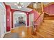 Elegant foyer with hardwood floors, staircase, and natural light at 107 Stargrass Ave, Clayton, NC 27527