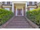 Inviting front entrance with brick steps and wrought iron railings at 107 Stargrass Ave, Clayton, NC 27527