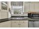 Bright kitchen featuring stainless steel appliances, and ample countertop space at 107 Stargrass Ave, Clayton, NC 27527