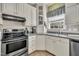 Well-lit kitchen features modern appliances and ample counter space for cooking at 107 Stargrass Ave, Clayton, NC 27527