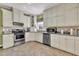 Bright kitchen featuring stainless steel appliances, and ample countertop space at 107 Stargrass Ave, Clayton, NC 27527
