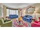 Charming living room with hardwood floors, bay window, and elegant decor with a large decorative mirror at 107 Stargrass Ave, Clayton, NC 27527