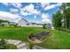 This backyard features a lush lawn, a charming shed, and thoughtfully designed garden beds at 108 Wilson Farm Ln, Clayton, NC 27527