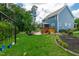 Large backyard with a deck, swing set and lush greenery at 108 Wilson Farm Ln, Clayton, NC 27527