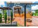 This backyard features a screened porch, patio with a fire pit, and manicured landscaping at 108 Wilson Farm Ln, Clayton, NC 27527