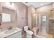 Bathroom featuring walk-in shower with glass doors, toilet, and vanity at 108 Wilson Farm Ln, Clayton, NC 27527