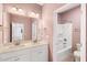 Bathroom featuring double sinks, modern fixtures, and a bathtub with shower at 108 Wilson Farm Ln, Clayton, NC 27527
