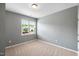 This bedroom features neutral paint, carpet, window and natural light at 108 Wilson Farm Ln, Clayton, NC 27527