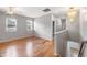 Upstairs hallway with hardwood flooring, chandelier, and two windows at 108 Wilson Farm Ln, Clayton, NC 27527