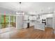 Kitchen featuring island, stainless appliances, and modern white cabinets at 108 Wilson Farm Ln, Clayton, NC 27527