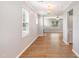 Open-concept living room with lots of natural light and hardwood floors at 108 Wilson Farm Ln, Clayton, NC 27527