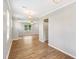 Spacious living room with hardwood floors, neutral walls and modern light fixtures at 108 Wilson Farm Ln, Clayton, NC 27527