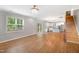 Open concept living room with hardwood floors, stairs, and view of kitchen at 108 Wilson Farm Ln, Clayton, NC 27527