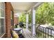 Cozy outdoor balcony with a table and chairs, perfect for enjoying a neighborhood view at 109 Longchamp Ln, Cary, NC 27519