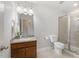 Modern bathroom with vanity, mirror, toilet and glass enclosed shower at 109 Longchamp Ln, Cary, NC 27519