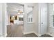 Open-concept living space with sleek flooring and views into the kitchen at 109 Longchamp Ln, Cary, NC 27519