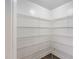 Walk-in pantry with wire shelving and laminate flooring at 109 Longchamp Ln, Cary, NC 27519