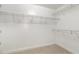 Spacious walk-in closet with wire shelving for optimal storage and organization at 109 Longchamp Ln, Cary, NC 27519