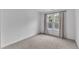 Neutral bedroom with carpeted floors and a large window with curtains at 11012 Southwalk Ln, Raleigh, NC 27614