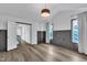 Bright bedroom with paneled walls, hardwood floors, and large windows at 11012 Southwalk Ln, Raleigh, NC 27614