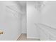 Walk-in closet features carpeted floors and ample shelving at 11012 Southwalk Ln, Raleigh, NC 27614