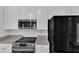 Close-up of kitchen featuring stainless steel appliances and granite countertops at 11012 Southwalk Ln, Raleigh, NC 27614