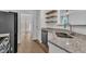 Kitchen area with stainless steel appliances, granite countertops and open shelving at 11012 Southwalk Ln, Raleigh, NC 27614