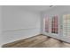 Bright room with hardwood floors, white trim, and French doors to the outside at 11012 Southwalk Ln, Raleigh, NC 27614