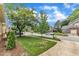 View of houses along a residential street showing yards, trees, and parked vehicles at 11012 Southwalk Ln, Raleigh, NC 27614